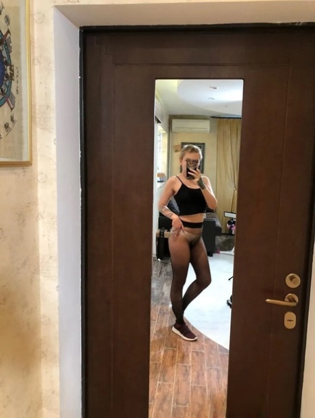 Sexy cheerleader takes nude selfies showing her small tits & her hot ass