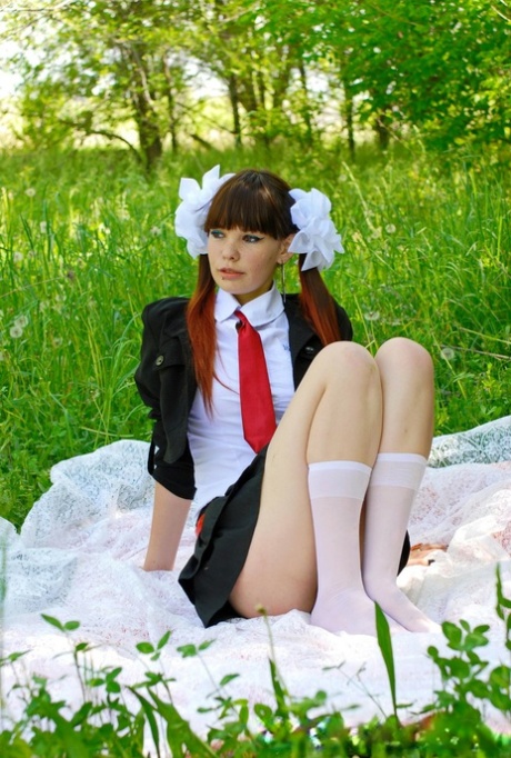 18-year-old schoolgirl peels on a blanket outdoors & shows her big ass & holes