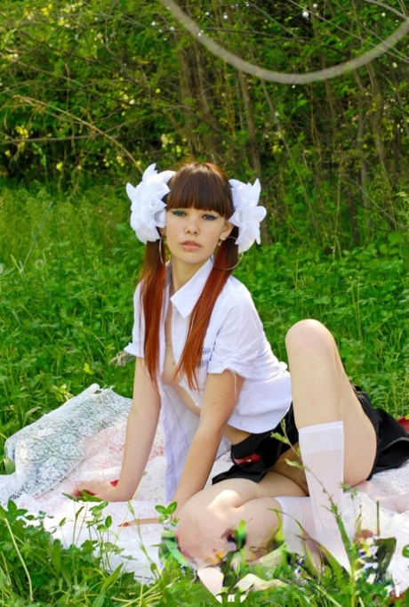 18-year-old schoolgirl peels on a blanket outdoors & shows her big ass & holes