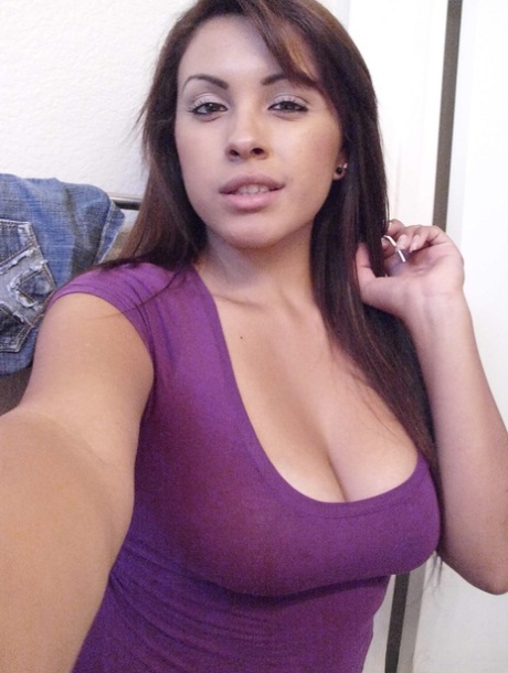 Solo girl Jeanette takes self shots in a mirror of her great boobs