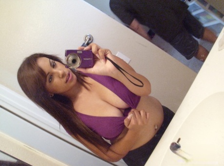 Solo girl Jeanette takes self shots in a mirror of her great boobs