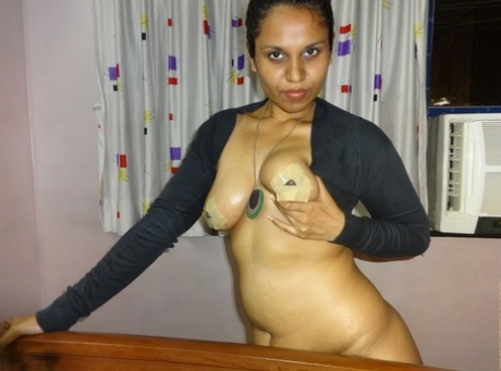 Fat Indian chick flaunts her big boobs during a live webcam show