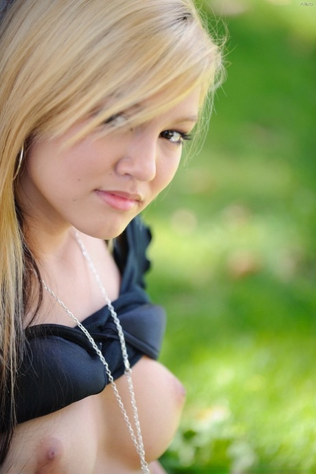 Amateur blonde Alexa bares her tasty nipples and masturbates below a tree