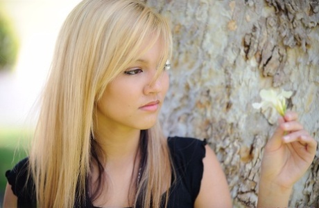 Amateur blonde Alexa bares her tasty nipples and masturbates below a tree