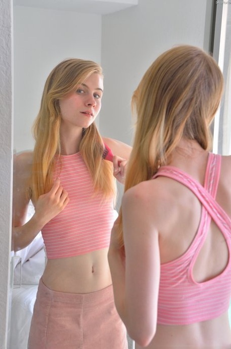 Slender girl Sharlotte stuffs her femininity with her fingers and a toy in a solo