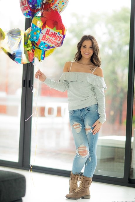 Brunette American babe Gia Paige strips and exposes her alluring white panties