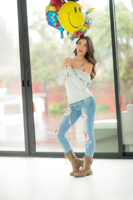 Brunette American babe Gia Paige strips and exposes her alluring white panties