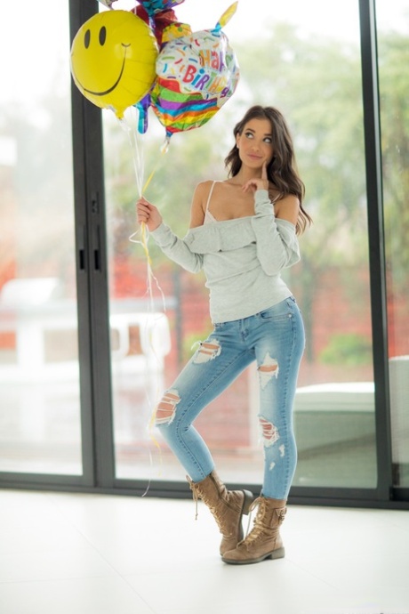 Brunette American babe Gia Paige strips and exposes her alluring white panties