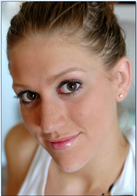 Big titted young adult babe Eve Laurence strips and fondles shaved slit